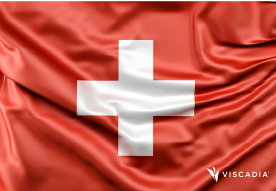 A red flag with a white cross in the center, symbolizing Switzerland; the Viscadia logo appears in the bottom right corner.